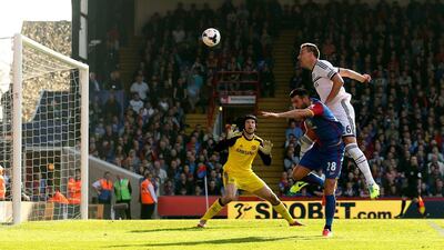 John Terry, right, of Chelsea is pressurised by Joe Ledley of Crystal Palace and heads the ball over his goalkeeperPetr Cech to open the scoring with an own goal during the Premier League match between Crystal Palace and Chelsea at Selhurst Park on March 29, 2014 in London, England. Scott Heavey/Getty Images