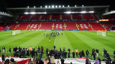 Spectators in the stands watch Real Madrid players during a training session at Anfield, Liverpool. PA
