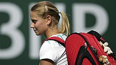 Jelena Dokic exits the court in dismay after losing in straight sets in her first round match of the BNP Paribas Open to Jill Craybas.