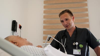 Mark Fielding at Amana Healthcare hospital in Khalifa City, is among a rising number of men in nursing. Ravindranath K / The National