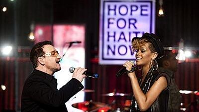 Singers Bono, left, and Rihanna perform during the Hope For Haiti Now: A Global Benefit For Earthquake Relief telethon in London yesterday.