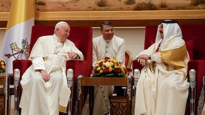 Pope Francis shares a lighter moment with Bahrain's King Hamad bin Isa Al Khalifa at the Sakhir Air Base, Bahrain. Pope Francis's November 3-6 visit is part of his effort to pursue dialogue with the Muslim world. AP Photo