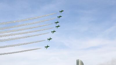 The Al Fursan aerobatic team light up the skyline of Abu Dhabi. Khushnum Bhandari / The National