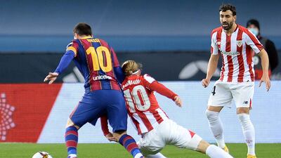 Barcelona's Lionel Messi and Bilbao forward Iker Muniain. AFP