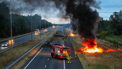 Firefighters at the scene as farmers set manure and hay bales alight in a protest on the A50 in Apeldoorn, the Netherlands. Dutch farmers are demonstrating against the government's nitrogen policy. EPA