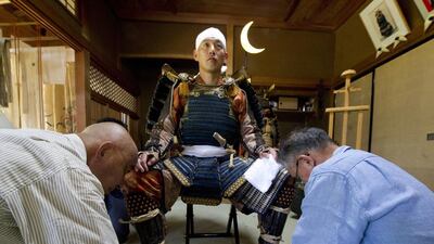 Michitane Soma (L), 34th generation lord of the Soma domain is being dressed by retainers in 10th century period costume prior to a rehearsal of the Soma-Nomaoi samurai festival in Soma city, located 40 kilometers from the destroyed nuclear power plants in Fukushima prefecture, Japan. The Soma family members continue to be treated as rulers by the inhabitants of Soma. The Soma area has an 1,100 year samurai tradition that is celebrated every summer during the annual Soma-Nomaoi festival. The three-day event attracts thousands of people to watch the 450 participants on horseback and dressed in antique 10th century period costumes to perform in cavalry displays, races and competitions. Everett Kennedy / EPA