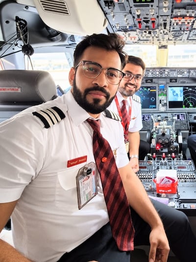 Capt Smit Machchhar looks over the shoulder of Capt Dharav Gosalia on a SpiceJet flight several years ago. Dharav Gosalia