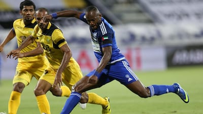 Jires Kembo-Ekoko of al Nasr, right, shoots on goal during a match against Al Wasl in Dubai. Ashraf Al Amra / Al Ittihad