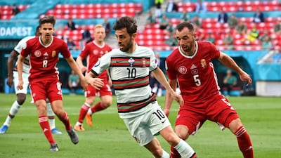 Portugal's Bernardo Silva under pressure from Attila Fiola of Hungary. PA