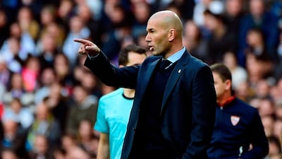 Zinedine Zidane faces the challenge of guiding Real Madrid past Paris Saint-Germain in the last 16 of the Uefa Champions League. Pierre-Philipe Marcou / AFP