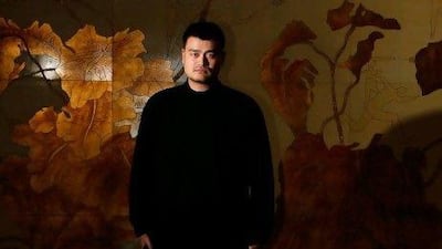 Former Chinese and NBA basketball star Yao Ming poses for a photograph after an interview with Reuters in Shanghai February 22, 2012. Chinese basketball icon Yao has been taken aback by Jeremy Lin's rise at the New York Knicks and thinks his style and size could make China's state sports system rethink how it selects and grooms its athletes. Picture taken February 22, 2012. To match Interivew NBA/YAO REUTERS/Aly Song (CHINA - Tags: SPORT BASKETBALL) *** Local Caption *** SHA101_NBA-YAO_0223_11.JPG