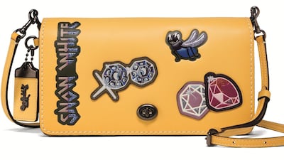 Throw this crossbody bag on for a blast of sunshine yellow; Dh799, Coach