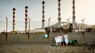 First Place, People and Nature, Janusz Jurek, Poland. The photo, taken in Greece, of a huge factory that broke into the sea.