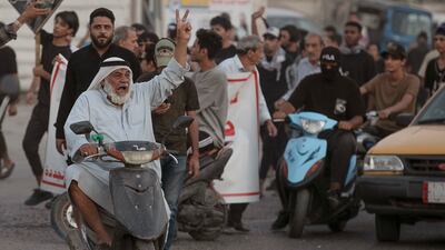 Protesters mark the third anniversary of the anti-government protests in central Basra, Iraq. AP