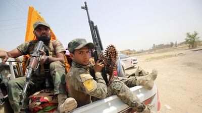 Iraqi pro-government forces reach Al Sejar village on the boundaries of ISIL-held Fallujah on Saturday. Ahmad Al Rubaye/AFP