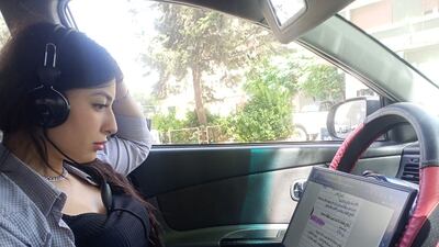 Jawahir Fakhro spends hours in her car every week, recording texts requested by blind students, as part of her volunteering in Read With My Eyes initiative. Image by Safaa Sallal