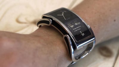 A woman presents an “intelligent watch” Ibis by Finnish company Creoir during at the Mobile World Congress in Barcelona. Quique Garcia / AFP