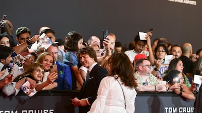 Fans take photos with Cruise