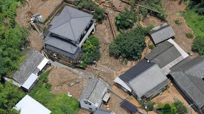 This aerial view shows the site of a mudslide caused by heavy rain in Ashikita town, Kumamoto prefecture. Kyodo News via AP