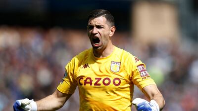 Aston Villa goalkeeper Emiliano Martinez celebrates after Danny Ings' goal. Reuters