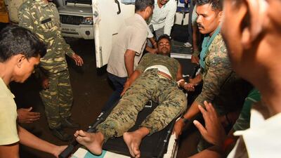 An injured Indian paramilitary soldier is brought to hospital following an attack by suspected Maoist rebels. At least 10 soldiers were killed in the ambush in east India. Suman / AFP Photo