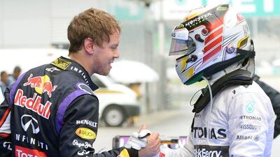 Nico Rosberg, on 43 points, and Lewis Hamilton (right), on 25 points, have Mercedes-GP at one-two in the drivers standings. Sebastian Vettel, left, is seventh with 15. Roslan Rahman / AFP