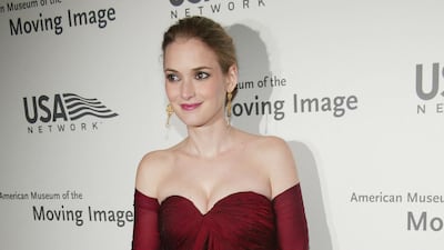 Winona Ryder in a deep red, off-the-shoulder gown, attends the American Museum Of The Moving Image Salute to Richard Gere at The Waldorf-Astoria Hotel on April 20, 2004, in New York City. AFP
