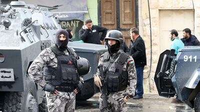 Jordanian security forces stand guard near the Crusader castle in Karak, a day after an attack by ISIL killed 10 people. AFP PHOTO / Khalil MAZRAAWI