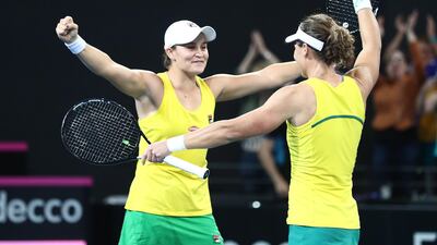 Ashleigh Barty, left, Samantha Stosur celebrate after winning the crucial doubles match against Belarus. Getty