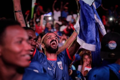 Cape Verde fans celebrate as they watch the team draw with Uruguay in capital Praia. AFP