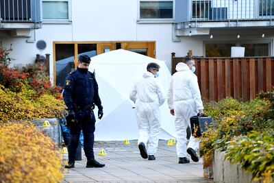 Forensic police at a crime scene where a Swedish musician was shot dead in Stockholm. AP