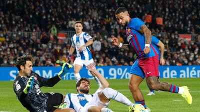 Barcelona's Memphis Depay (standing) wins the penalty, from where he will score the game's only goal . Reuters