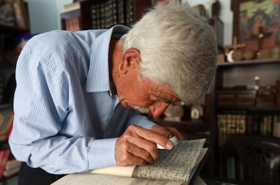 George Zaarour studying Aramic texts. AFP