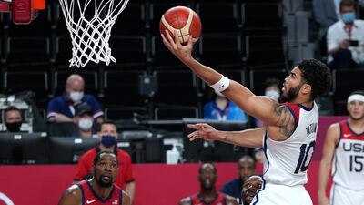 USA's Jayson Tatum scores a basket.