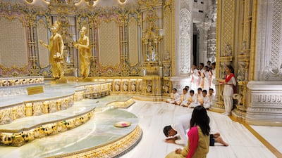 Mr Sunak and his wife Mrs Murty offer prayers as they visit the Akshardham Hindu Temple in New Delhi, India. Getty Images