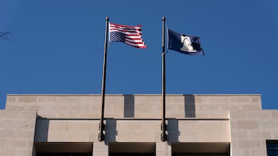 An American flag flies upside-down at the conservative Heritage Foundation think tank in Washington. The upside-down flag has become a pro-Trump symbol of protest in the US. AP