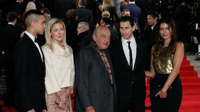 With Omar and Karim Al-Fayed at the Royal Film Performance of Spectre at the Royal Albert Hall, London, in 2015. Getty Images