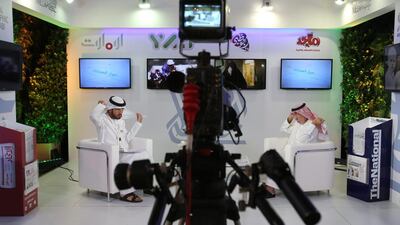 An Emirati television anchor and his guest gear up for a programme at the Arab Media Forum in Dubai, which was held at the Dubai World Trade Centre. Kamran Jebreili / AP