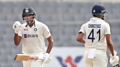 India's Ravichandran Ashwin, left, and Shreyas Iyer celebrates after scoring the final run to beat Bangladesh on the fourth day of the second cricket test match, in Dhaka, Bangladesh, Sunday, Dec. 25, 2022. (AP Photo / Surjeet Yadav)