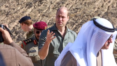 Prince William (C), Duke of Cambridge, speaks while attending the Exercise Desert Warrior between British and Kuwaiti forces at Sheikh Salem al-Ali al-Sabah Camp, about 40 kilometres north of Kuwait City. AFP