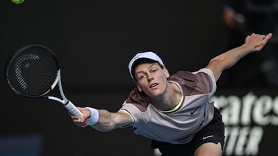 Jannik Sinner hits a return on his way to victory against Novak Djokovic. AFP