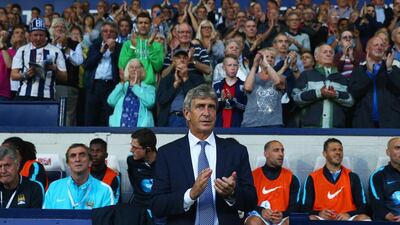 Manchester City manager Manuel Pellegrini has moved to a 4-3-3 setup after using a two striker formation for most of last season. Michael Steele / Getty Images