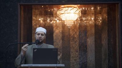Imam Magdy Badr leads prayers over a live broadcast on a laptop in a nearly empty room at Masjid Al Salaam mosque on the first full day of Ramada in Dearborn, Michigan. Getty Images via AFP