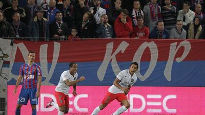 Paris Saint-Germain's Marquinhos, right, celebrates after scoring a goal in PSG's win over Caen in Ligue 1 on Wednesday. Charly Triballeau / AFP / September 24, 2014