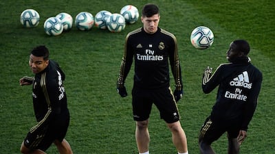 Luka Jovic, centre, with teammates. AFP