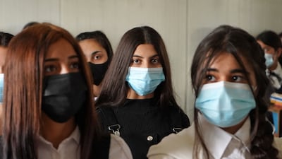 Yazidi girls sit in class on the first day of school at a displaced persons camp in the Sharya area, about 15 kilometres from the city of Dohuk in Iraqi Kurdistan. AFP