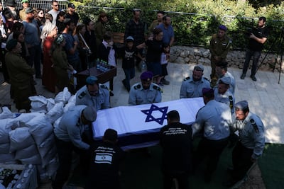 Soldiers carry the coffin of Israeli soldier Master Sergeant Yona Efraim Feldbaum who, according to the Israeli army, was killed by 'enemy fire' in Gaza, at his funeral in Jerusalem. Reuters
