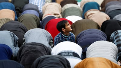 A boy is distracted by a drone as Muslims offer prayers on the first Friday of Ramadan at Jamia Masjid in Srinagar, the summer capital of Jammu and Kashmir. Reuters