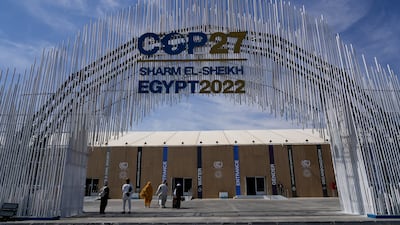 Guests enter the convention center hosting the COP27 U.N. Climate Summit. AP Photo