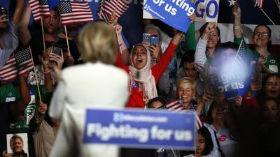 Democratic presidential candidate Hillary Clinton waves to Muslim supporters during a campaign rally in March 2016. Rhona Wise / AFP